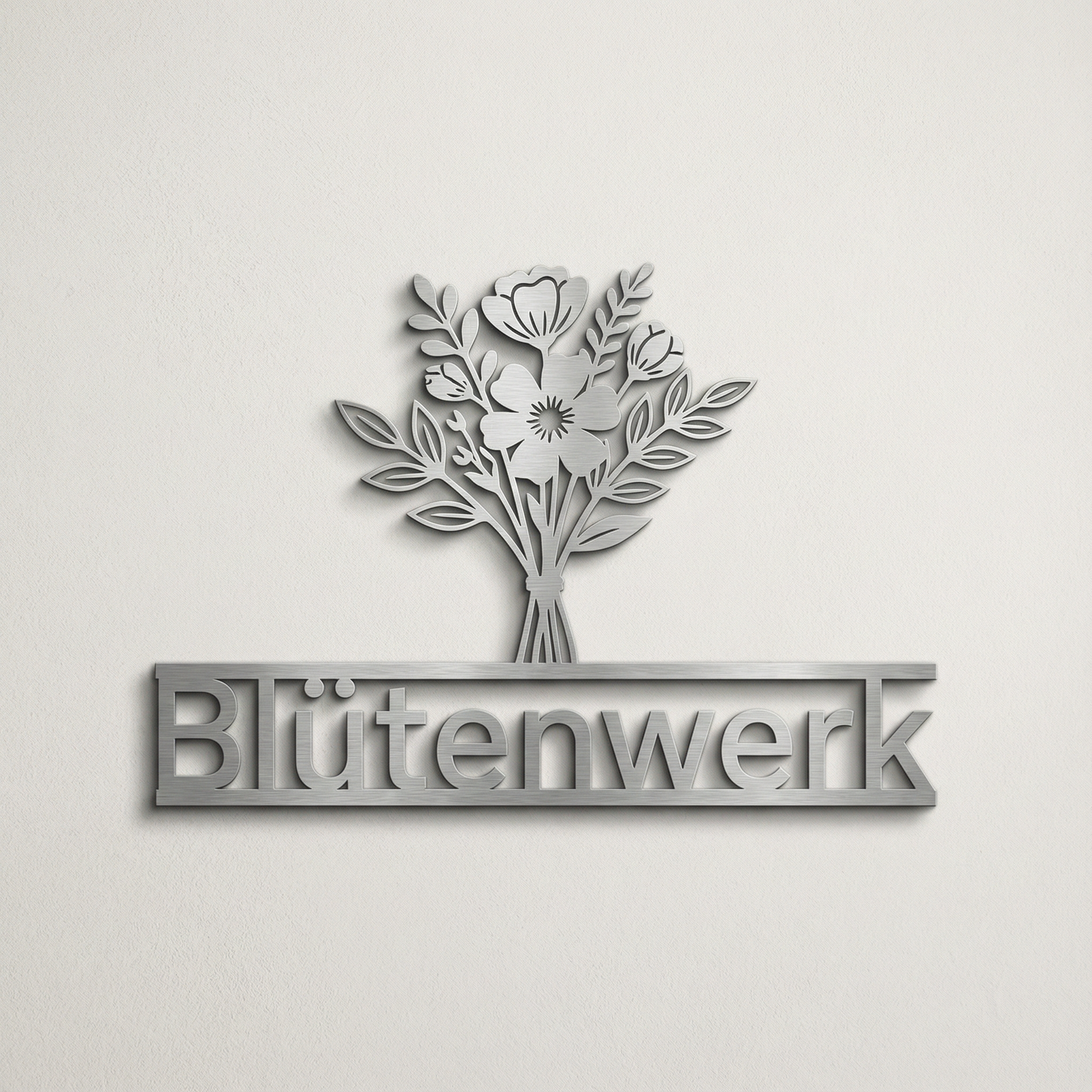 3D-Firmenschild aus V2A Edelstahl an Wand, Blumenmotiv mit Schriftzug „Blütenwerk“